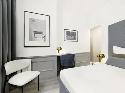 Un ou plusieurs lits dans un hébergement de l'établissement LivinParis - Luxury 3 Bedrooms Le Marais I