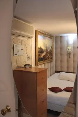 Un ou plusieurs lits dans un hébergement de l'établissement Hotel Hauteville Opera