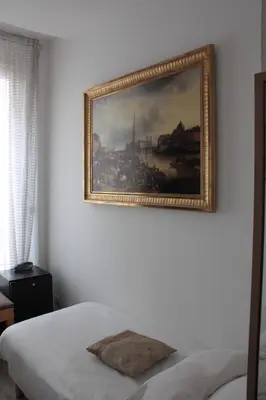 Un ou plusieurs lits dans un hébergement de l'établissement Hotel Hauteville Opera