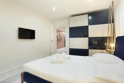 Un ou plusieurs lits dans un hébergement de l'établissement Rent a Room - Residence Bonne Nouvelle