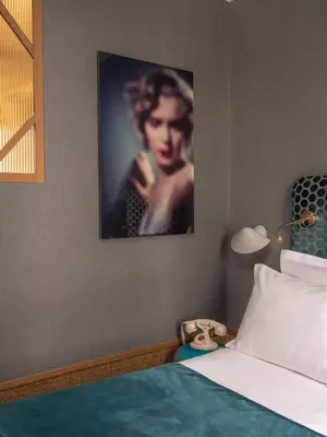 Un ou plusieurs lits dans un hébergement de l'établissement Handsome Hotel