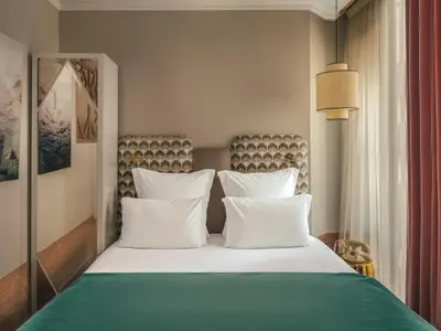 Un ou plusieurs lits dans un hébergement de l'établissement Handsome Hotel