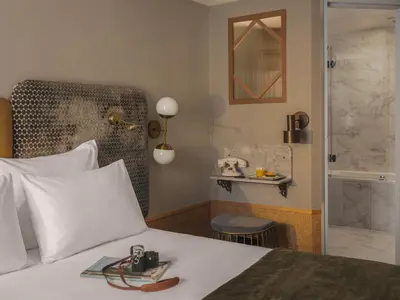 Un ou plusieurs lits dans un hébergement de l'établissement Handsome Hotel