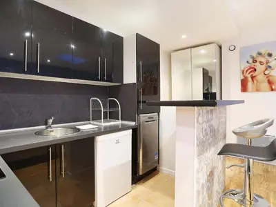 Cuisine ou kitchenette dans l'établissement Rent a Room - Residence Caire, Montorgueil