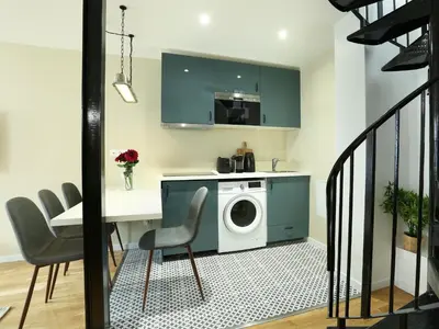 Coin salon dans l'établissement Rent a Room - Residence Caire, Montorgueil