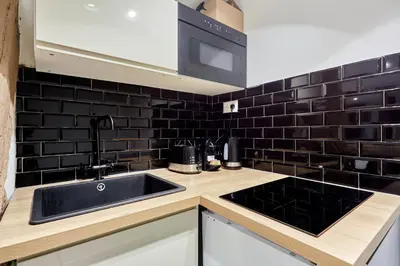 Cuisine ou kitchenette dans l'établissement Rent a Room - Residence Caire, Montorgueil