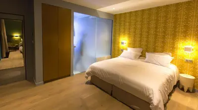 Un ou plusieurs lits dans un hébergement de l'établissement Eden Lodge Paris