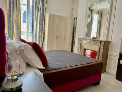 Un ou plusieurs lits dans un hébergement de l'établissement Haussmann Opera Penthouses 130M2