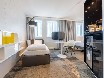 Télévision ou salle de divertissement dans l'établissement Novotel Suites Paris Expo Porte de Versailles