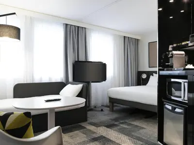 Télévision ou salle de divertissement dans l'établissement Novotel Suites Paris Expo Porte de Versailles