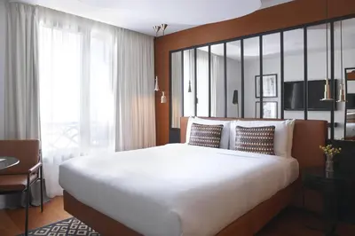 Un ou plusieurs lits dans un hébergement de l'établissement Renaissance Paris Republique Hotel & Spa