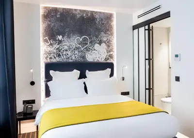 Un ou plusieurs lits dans un hébergement de l'établissement Hotel Scarlett
