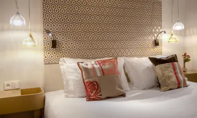 Un ou plusieurs lits dans un hébergement de l'établissement Hôtel Sèvres Saint Germain
