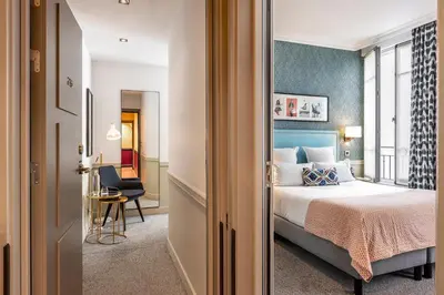 Un ou plusieurs lits dans un hébergement de l'établissement Hôtel Adèle & Jules
