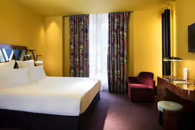 Un ou plusieurs lits dans un hébergement de l'établissement Hôtel Saint-Marc
