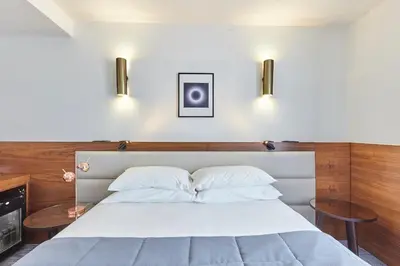 Un ou plusieurs lits dans un hébergement de l'établissement Hotel Royal Phare