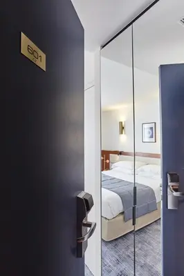 Un ou plusieurs lits dans un hébergement de l'établissement Hotel Royal Phare