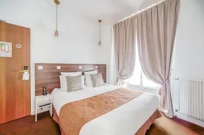 Un ou plusieurs lits dans un hébergement de l'établissement Queens Boutique Hotel