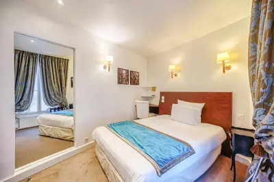 Un ou plusieurs lits dans un hébergement de l'établissement Queens Boutique Hotel
