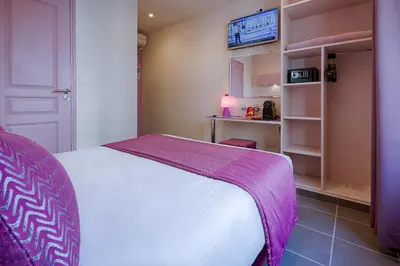 Un ou plusieurs lits dans un hébergement de l'établissement Hotel La Petite Rosa