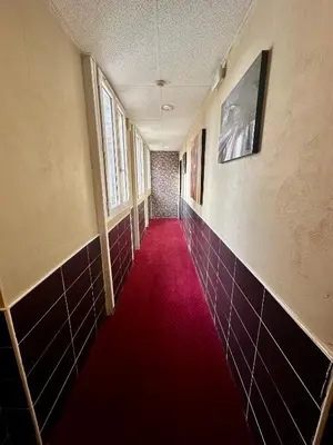 Télévision ou salle de divertissement dans l'établissement Hotel Victor Hugo