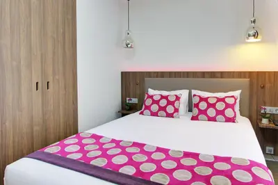 Un ou plusieurs lits dans un hébergement de l'établissement Hotel Alhambra