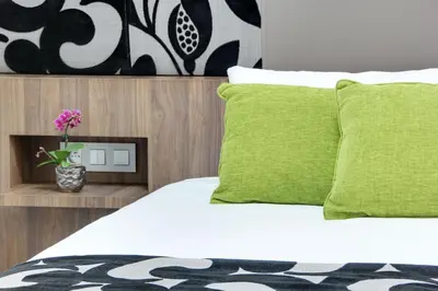Un ou plusieurs lits dans un hébergement de l'établissement Hotel Alhambra