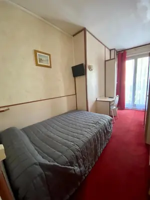 Un ou plusieurs lits dans un hébergement de l'établissement Hotel Studia