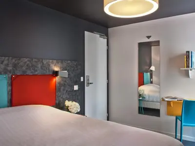 Un ou plusieurs lits dans un hébergement de l'établissement Hôtel des Métallos