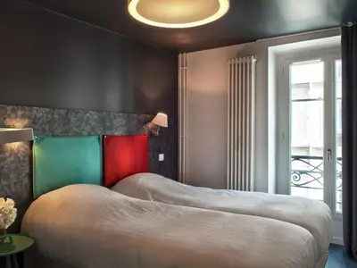 Un ou plusieurs lits dans un hébergement de l'établissement Hôtel des Métallos