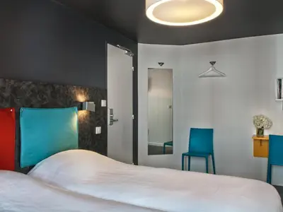 Un ou plusieurs lits dans un hébergement de l'établissement Hôtel des Métallos