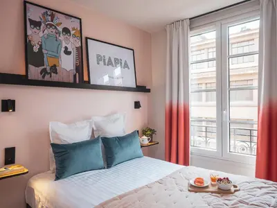 Un ou plusieurs lits dans un hébergement de l'établissement Hôtel Piapia
