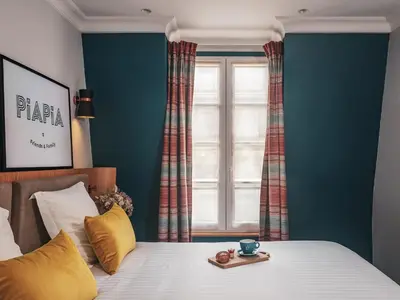 Un ou plusieurs lits dans un hébergement de l'établissement Hôtel Piapia