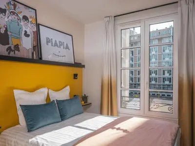 Un ou plusieurs lits dans un hébergement de l'établissement Hôtel Piapia
