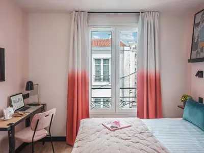 Un ou plusieurs lits dans un hébergement de l'établissement Hôtel Piapia