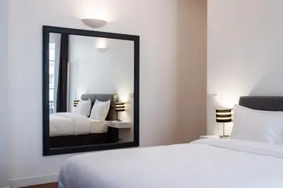 Un ou plusieurs lits dans un hébergement de l'établissement Paris Square