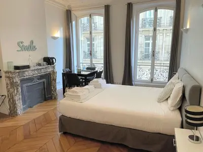 Un ou plusieurs lits dans un hébergement de l'établissement Paris Square