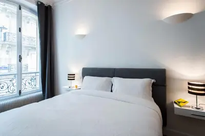 Un ou plusieurs lits dans un hébergement de l'établissement Paris Square