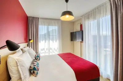 Un ou plusieurs lits dans un hébergement de l'établissement Appart'City Confort Paris Clichy - Mairie