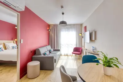 Un ou plusieurs lits dans un hébergement de l'établissement Appart'City Confort Paris Clichy - Mairie