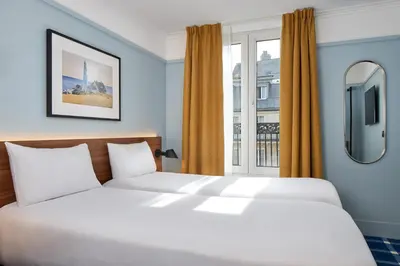 Un ou plusieurs lits dans un hébergement de l'établissement Timhotel Paris du Gare du Nord