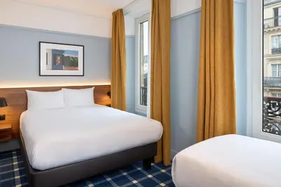 Un ou plusieurs lits dans un hébergement de l'établissement Timhotel Paris du Gare du Nord