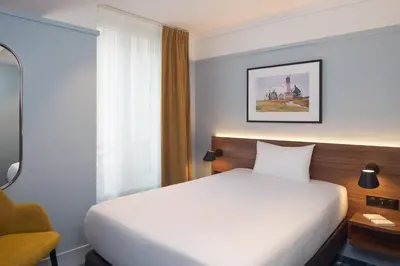 Un ou plusieurs lits dans un hébergement de l'établissement Timhotel Paris du Gare du Nord