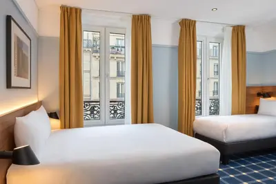 Un ou plusieurs lits dans un hébergement de l'établissement Timhotel Paris du Gare du Nord