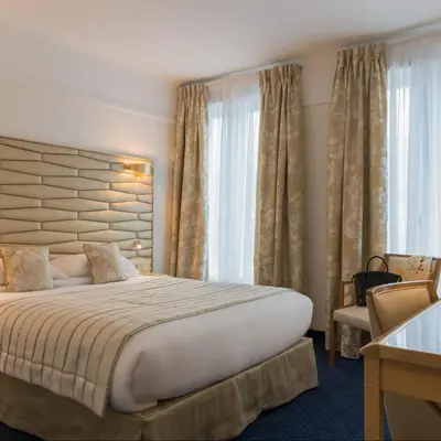Un ou plusieurs lits dans un hébergement de l'établissement Atlantic Hotel