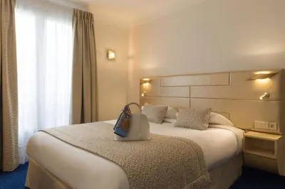 Un ou plusieurs lits dans un hébergement de l'établissement Atlantic Hotel