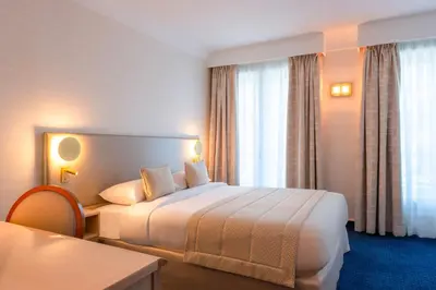 Un ou plusieurs lits dans un hébergement de l'établissement Atlantic Hotel