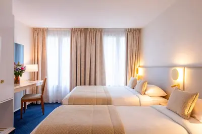 Un ou plusieurs lits dans un hébergement de l'établissement Atlantic Hotel