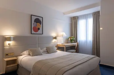 Un ou plusieurs lits dans un hébergement de l'établissement Atlantic Hotel
