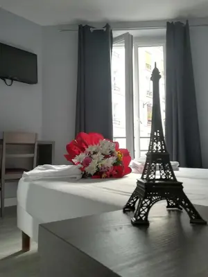 Un ou plusieurs lits dans un hébergement de l'établissement Hotel du Globe 18